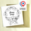 carte postale Bonne année avec couronne de houx et poinsettia à colorier imaginée par Anne Da Cunha-Guillegault en exclusivité pour la marque An'imato