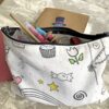 Recyclage : trousse en tissu à colorier fabriquée avec une des feuilles en tissu à colorier imaginée par Anne Da Cunha-Guillegault pour la marque An'imato